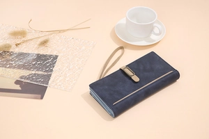 Detail of navy blue frosted wallet with vintage clasp and multi-layer accordion folds