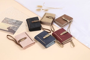 Short vintage wallets in six colors with metal ring buckles and hand straps