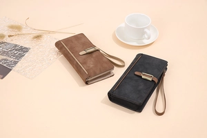 Detailed view of matte vintage wallets in coffee and black with metal buckle and wrist strap