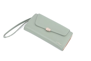 Detail view of mint green PU leather long wallet with pink floral buckle and wrist strap