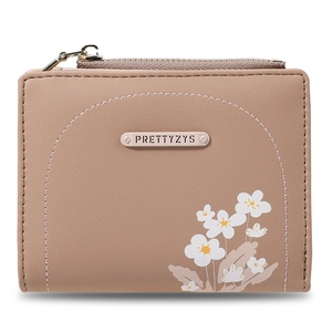 Dettaglio del portafoglio in pelle PU rosa con stampa floreale e cerniera in metallo