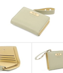 Detail view of mint green bifold wallet with gold heart buckle and interior card slots