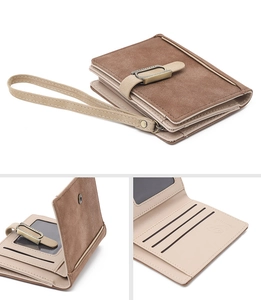 Detail view of brown matte PU leather wallet interior with card slots and wrist strap