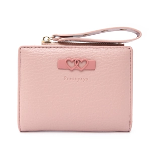 Close-up of pink litchi grain leather wallet featuring heart buckle and wrist strap