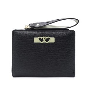 Close-up of black leather wallet with green double-heart hardware and wrist strap