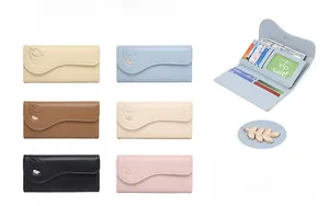 Detailed view of the three-fold long wallet interior with card slots and golden leaf pendant