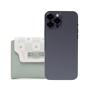 Short tri-fold light green floral wallet for women shown next to a smartphone for size scale