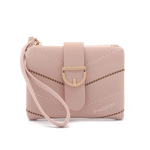 Detail of pink PU leather short wallet with V-quilted pattern and gold metal buckle