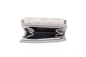 Detail of light green tri-fold wallet showing dual zipper pockets and pixel leaf print