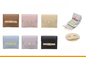 Detailed view of tri-fold wallet interior with card slots and metal brand buckle