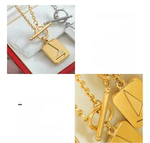 Detail of 18K gold plated titanium steel necklace with square sailboat pendant and OT buckle