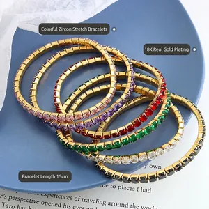 18K gold plated titanium bracelets with multi-color zircon crystals on blue ceramic plate