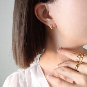 Minimalist golden teardrop stud earrings for women with sleek drop-shaped metal design