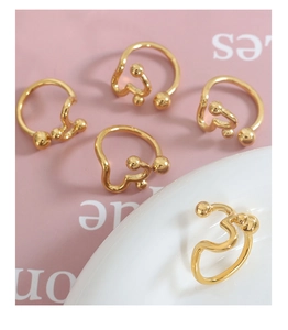 Set of five gold geometric wavy minimalist rings with polished metallic ball ends