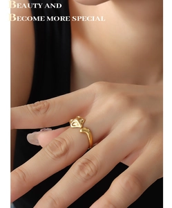 Detailed view of an adjustable golden fox ring with a sleek minimalist creative design
