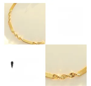 Macro detail of 18K gold plated titanium steel twist blade chain necklace texture