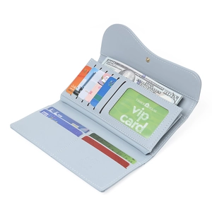Macro view of the light blue wallet interior with multiple card slots and an ID window