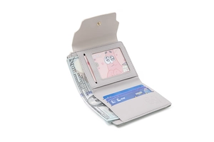 Interior detail of a trifold PU leather wallet showing card slots and a cash compartment