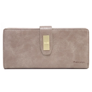 Detail view of mauve long wallet with textured finish and gold rectangular metal clasp