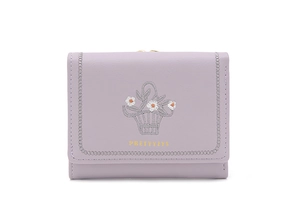 Detail of lavender PU leather wallet featuring floral embroidery and stitched edges