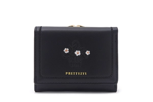 Close-up of black leather wallet with daisy embroidery and metal clasp detail