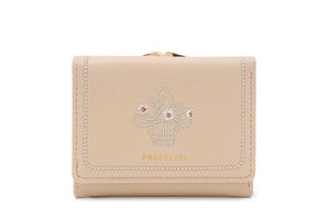 Detail view of cream PU leather wallet with floral embroidery and gold kiss-lock closure
