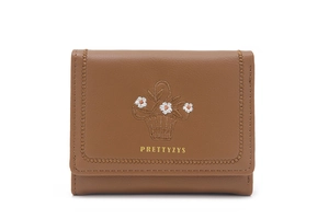Close-up of floral embroidery and brand lettering on brown bi-fold wallet for women