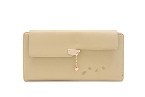 Detail of light yellow long wallet with heart pendant and embossed pattern