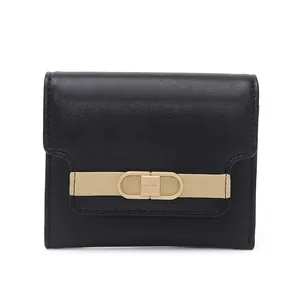Close-up of black short wallet with beige leather strap and gold metal buckle detail