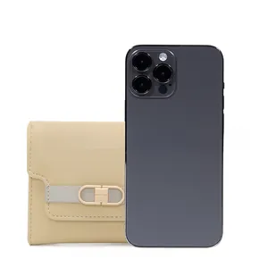 Compact light yellow leather wallet shown next to a smartphone for size comparison