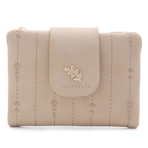 Close-up of beige short wallet featuring embroidered leaf texture and gold leaf buckle