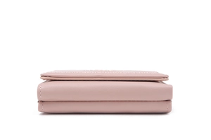 Side view of pink tri-fold leather wallet showing layered structure and stitching details