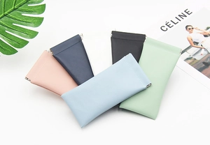 Squeeze pouch showing six colorful PU leather cases with automatic closing彈片 springs