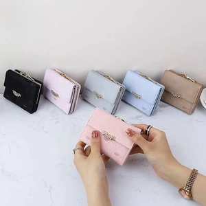 Retro tri-fold short wallet for women featuring leaf pendant and floral stitching detail