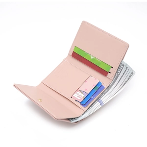 Detail of pink PU leather wallet showing card slots and spacious cash compartment