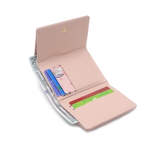 Pink tri-fold faux leather wallet for women with card slots and metal snap button