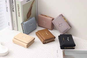 Close-up of the delicate floral basket embroidery on a stylish tri-fold PU leather wallet