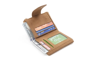 Deep brown tri-fold wallet interior detail showing card slots and large bill compartment