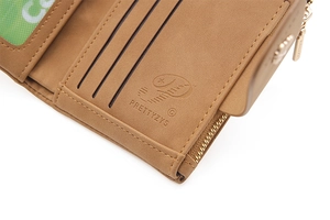 Detail view of brown leather wallet interior with three card slots and gold zipper