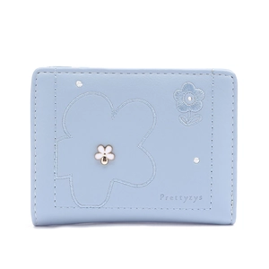 Close-up of light blue trifold wallet with floral embroidery and brand logo detail