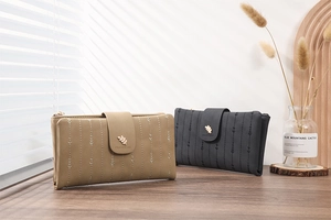 Detail of elegant PU leather long wallets with leaf buckle and vertical stitching decor