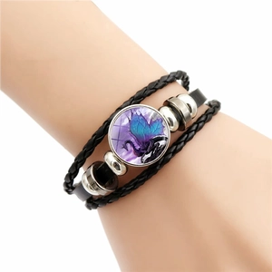 Multilayer leather bracelet featuring a vintage dragon glass cabochon on a braided cord
