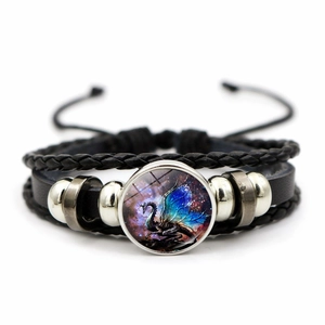 Handmade woven black leather bracelet featuring a colorful dragon glass cabochon charm