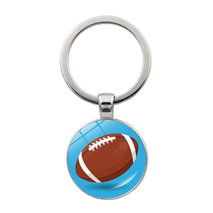 Detail of silver metal keychain with a blue football pendant and rugby ball design