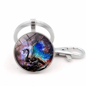 Blue wing dragon glass gem keychain with silver metal lobster clasp on white background