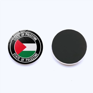 Detail of round Palestine flag fridge magnet with crystal dome and magnetic backing