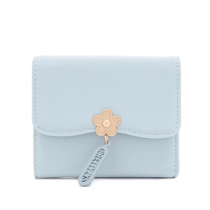 Detail of light blue tri-fold wallet with gold flower buckle and leather texture