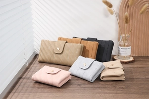 Close-up of long leaf-buckle PU leather wallets with vertical stitch texture in various colors