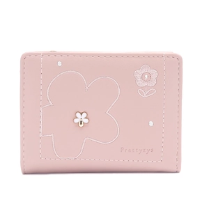 Detail of pink PU leather wallet featuring floral embroidery and small white flower clasp