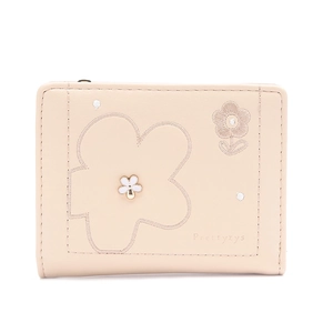 Detailed close-up of Prettyzys wallet with floral embroidery and white flower metal clasp